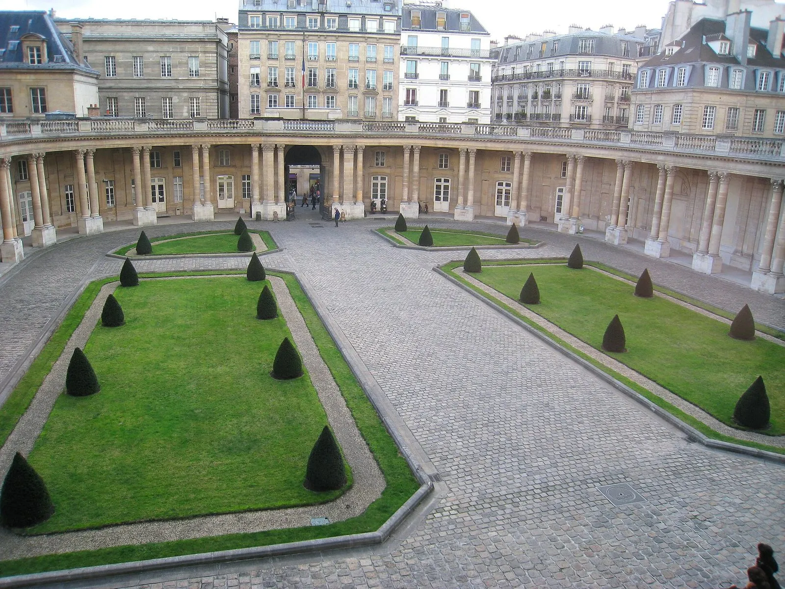 The curved colonnade and lawns of the courtyard of the Hôtel de Soubise